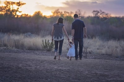 Parents walking with young child