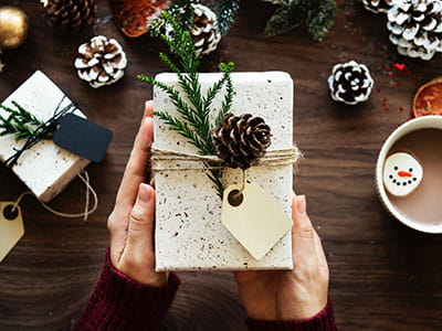 person handling a gift box