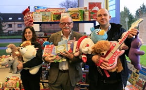 People holding Christmas donations