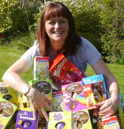 Woman holding collection of donated Easter eggs