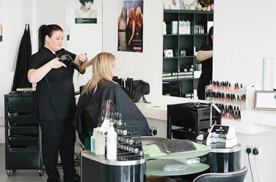 Ladies hairdresser in action