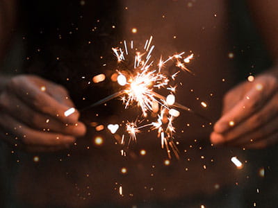 person holding fire works