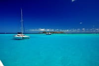 blue ocean with yachts 