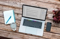 laptop and coffee on desk