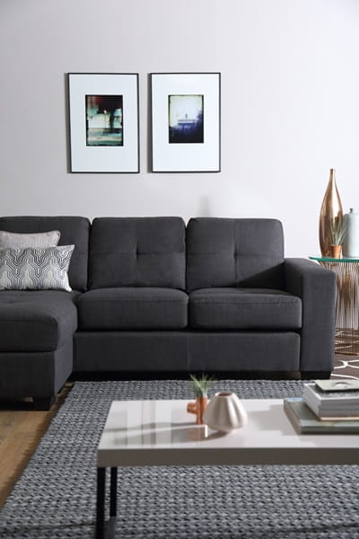 grey sofa by coffee table