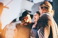 girls chatting on station platform