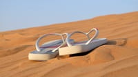 pair of sandals on beach