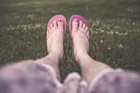 feet lazing in field