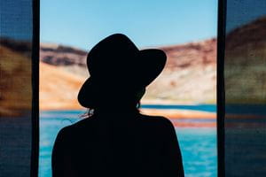 woman with had by sea