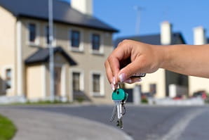 Holding set of new house keys