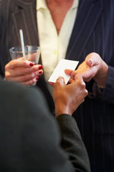Business people exchanging business cards