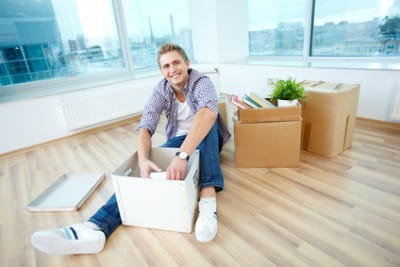 man unpacking a box