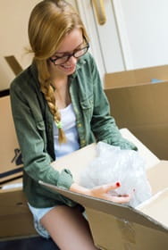 Girl packing a box