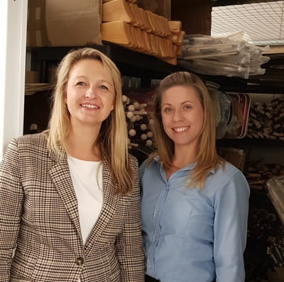 Owner of Green Owl Toys Izabela Hailey in her storage unit with and Access Self Storage team member Dee from Orpington Access Self Storage
