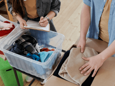 An image of people packing boxes for our New Year decluttering guide