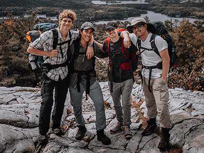 An image of friends hiking for our blog on hiking essentials for beginners
