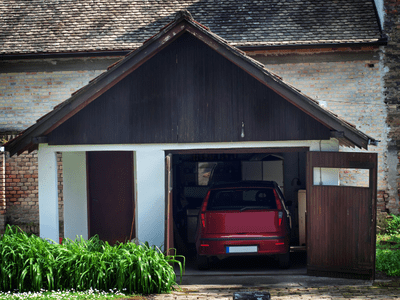 An image of a car in a garage for our page on how to store a car long term