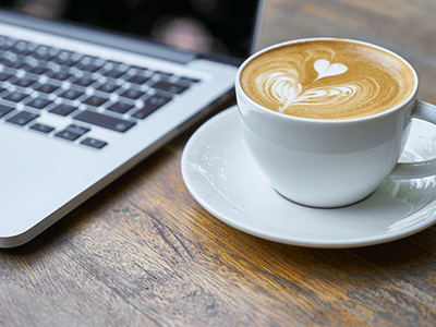 An image of a coffee and laptop for our page on Orpington cafés