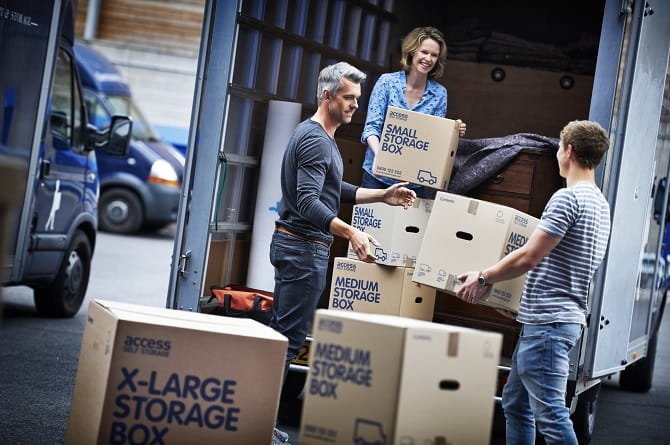 People handling boxes in a lorry